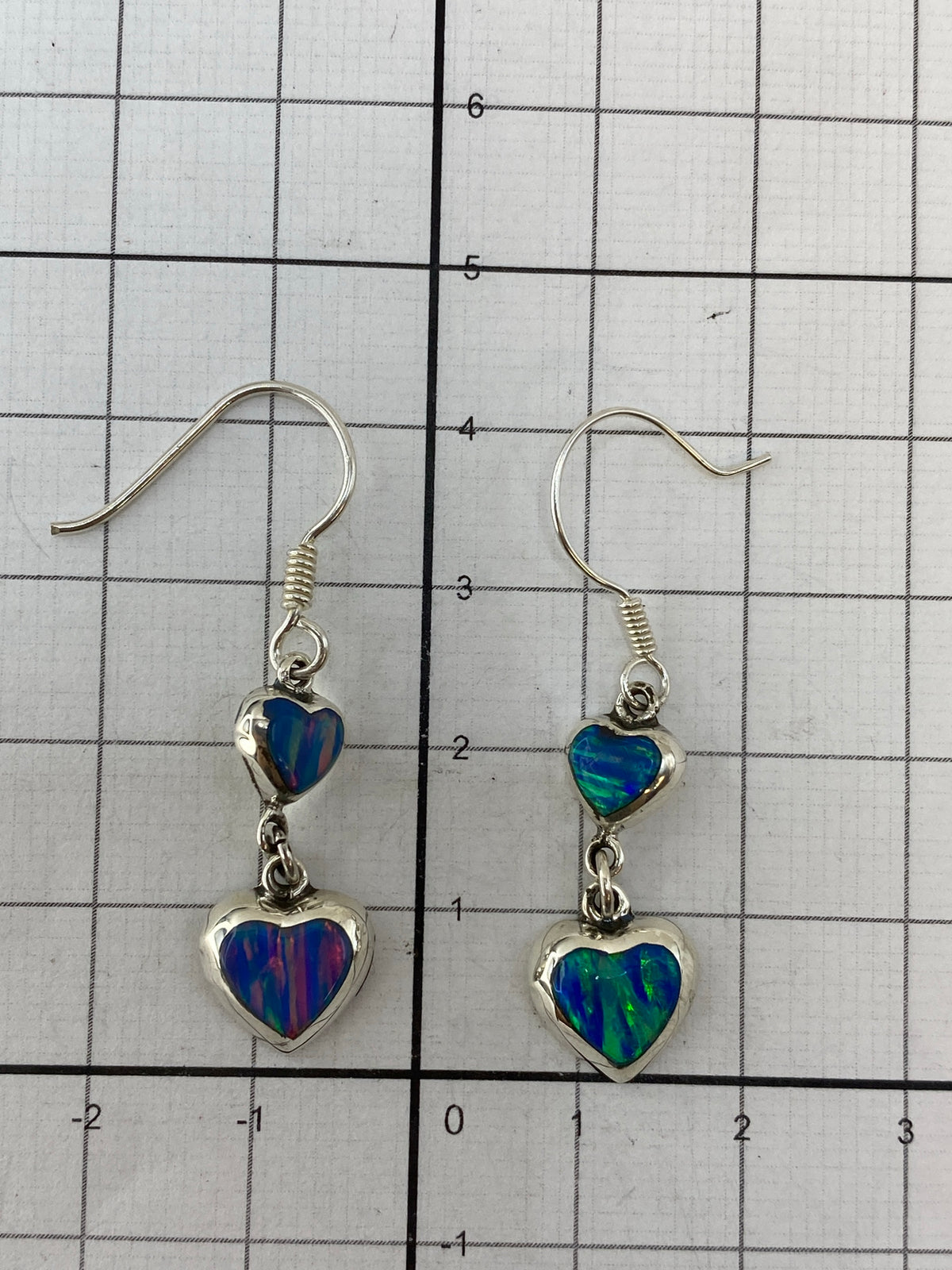 Reverse side of earrings showing .925 hallmark and polished silver finish