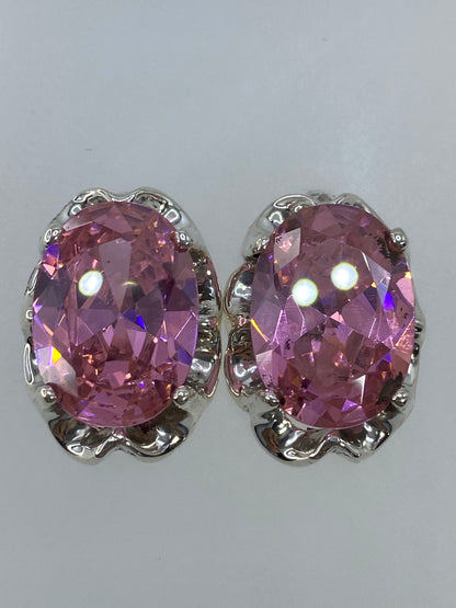Par de aretes de plata 925 con circonia rosa facetada en orejas