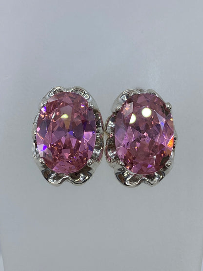 Aretes de circonia rosa en plata, vista frontal mostrando el brillo