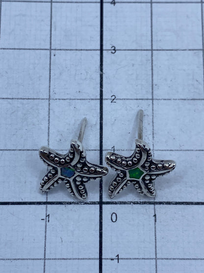 Aretes de plata sobre medidor de centímetros: largo 1.8 cm