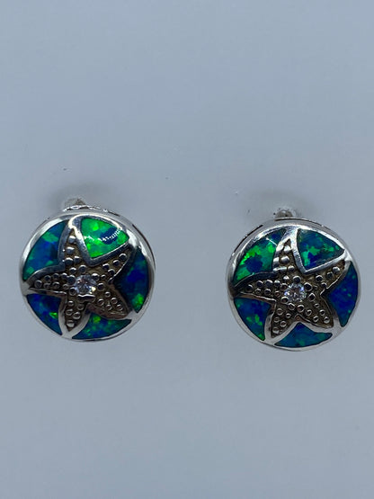 Par de aretes de plata 925 con ópalo de fuego azul, engastados a mano en Taxco