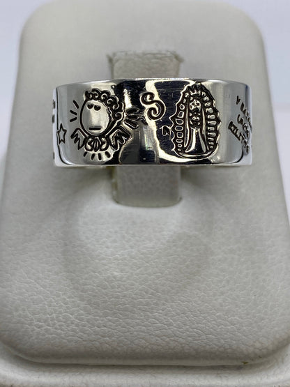 Anillo de plata 925 con grabado de motivos prehispánicos aztecas en banda ancha