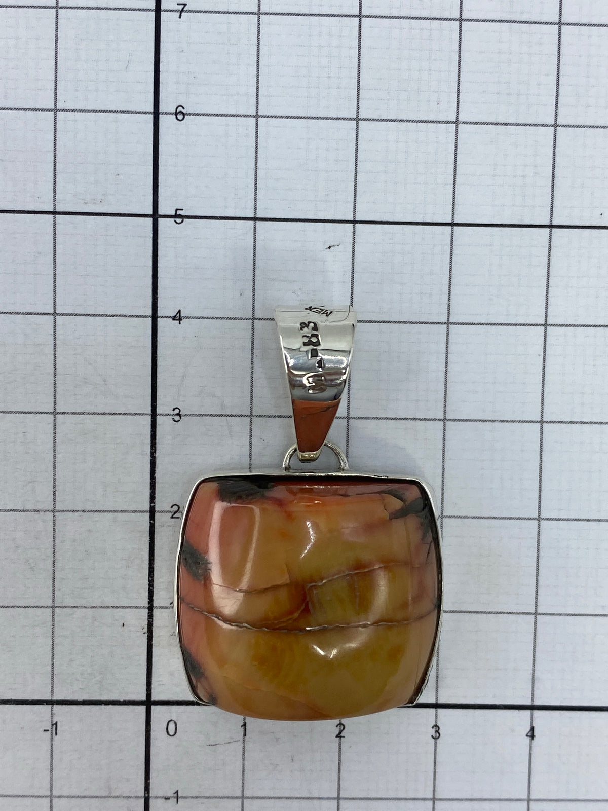 Reverso del dije con marca del Quinto 950 grabada