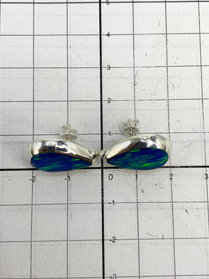 Reverso de los aretes mostrando el Quinto 925 grabado en plata