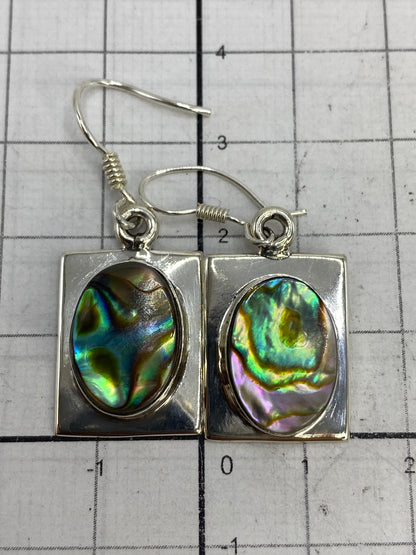Reverso de los aretes mostrando el Quinto 925 México grabado en la plata