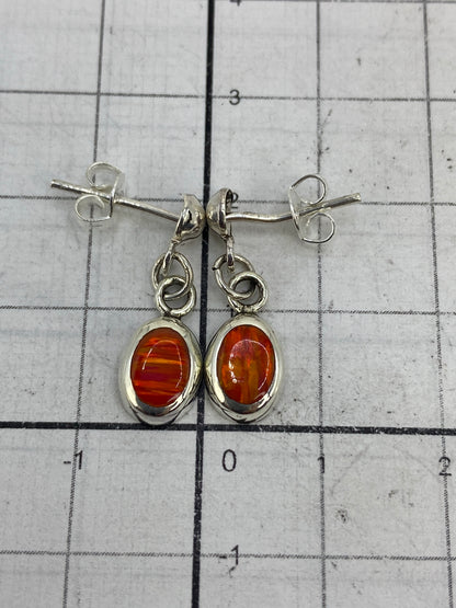 Side profile of the handcrafted fire opal earrings with silver posts