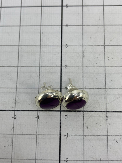 Reverso de los aretes mostrando el Quinto 925 en plata