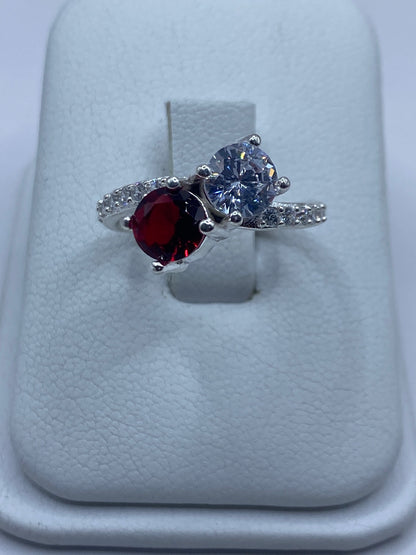 Anillo de plata 925 con circonia roja y blanca engastadas en dos tonos brillantes