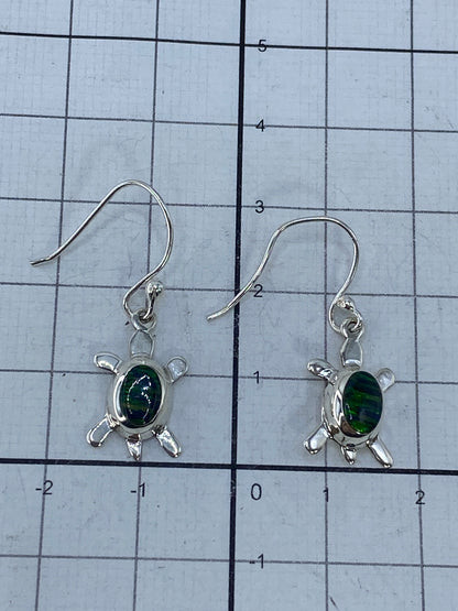 Reverso de los aretes mostrando el sello 925 de autenticidad en plata