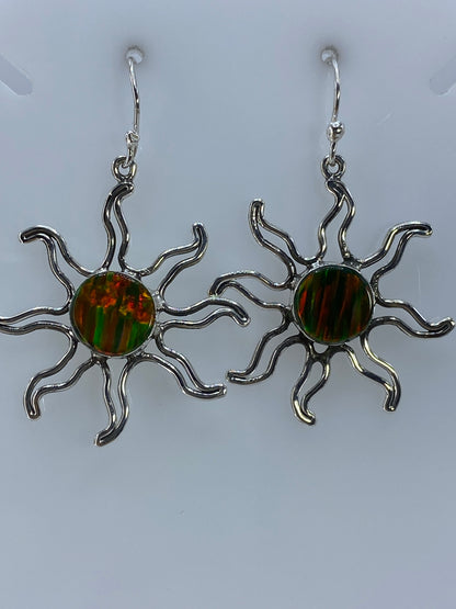 Aretes de ópalo de Fuego sobre regla métrica — 4 cm de largo