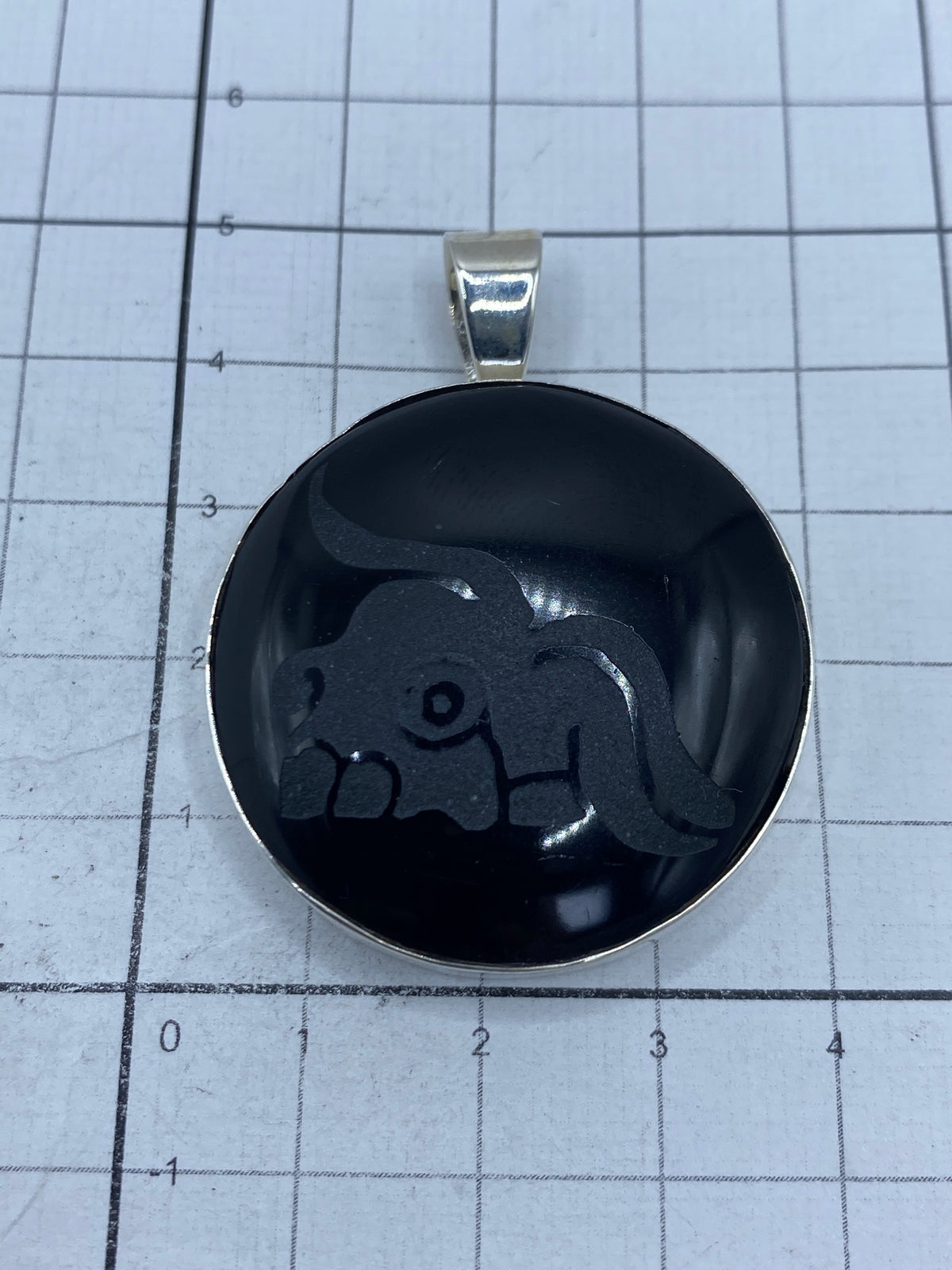 Reverso del dije con hallmark 950 y firma de joyería Taxco México