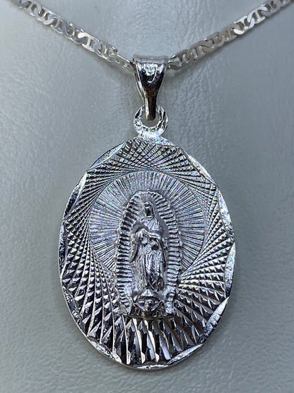 Detalle del relieve de la Guadalupana y los rayos en plata