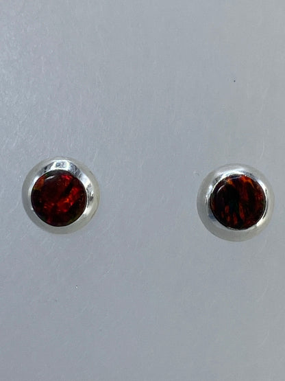 Aretes sobre regla de medicion para escala de tamaño