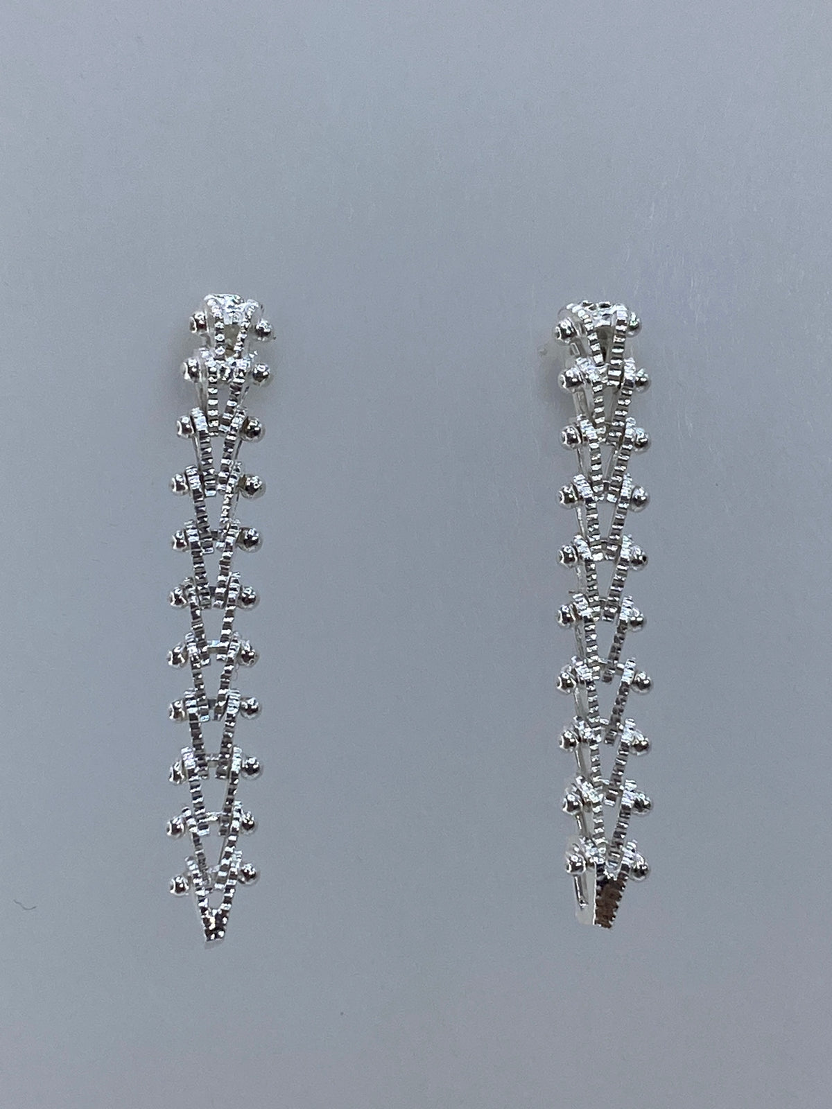 Aretes de plata 925 Taxco vista frontal mostrando el acabado pulido brillante