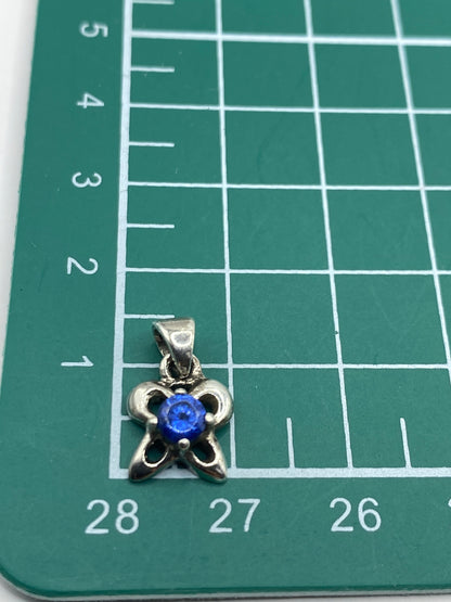 Reverso del dije de plata mostrando el Quinto 925