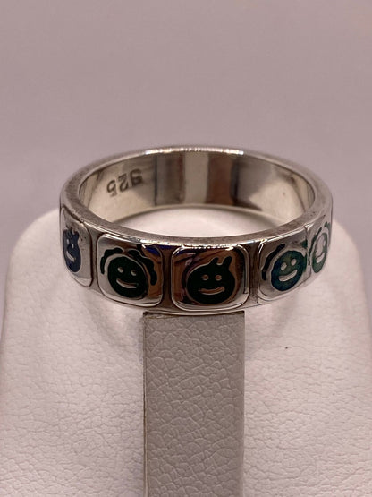 Anillo Artesanal con Caritas Esmaltadas en Plata, sello de autenticidad Plata Ley .925