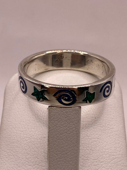 Anillo Artesanal con Estrellas y Espirales Esmaltadas en Plata, sello de autenticidad Plata Ley .925