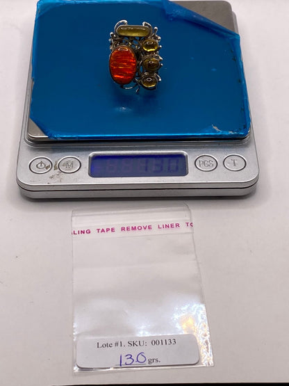 Anillo étnico escultórico de plata .950 con ópalo de fuego y ámbar natural sobre superficie — joyería artesanal mexicana Taxco