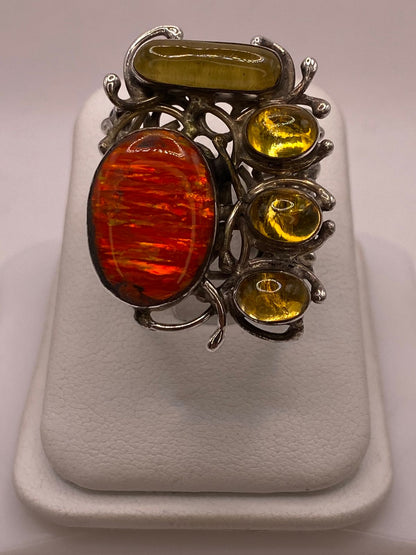 Anillo étnico de plata .950 con ópalo de fuego oval y 5 cabuchones de ámbar natural en montura orgánica — artesanal Taxco