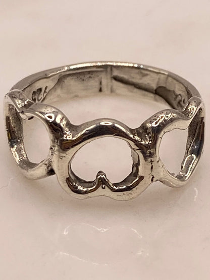 Anillo Artesanal en Plata con Corazones Entrelazados, sello de autenticidad Plata Ley .925