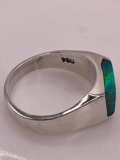 Anillo Asimétrico de Plata 950 con Ópalo de Fuego, sello de autenticidad Plata Ley .925