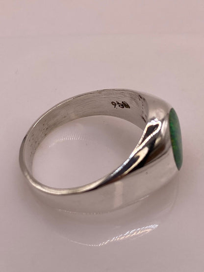 Anillo Contemporáneo con Ópalo de Fuego Verde en Plata .950, sello de autenticidad Plata Ley .925