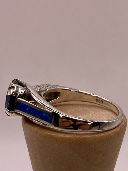 Anillo Contemporáneo con Ópalo de Fuego y Zirconia Azul en Plata .950, sello de autenticidad Plata Ley .925