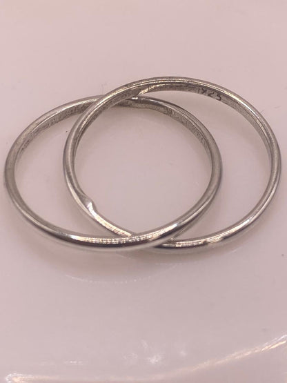 Anillo Doble Entrelazado en Plata .925, sello de autenticidad Plata Ley .925