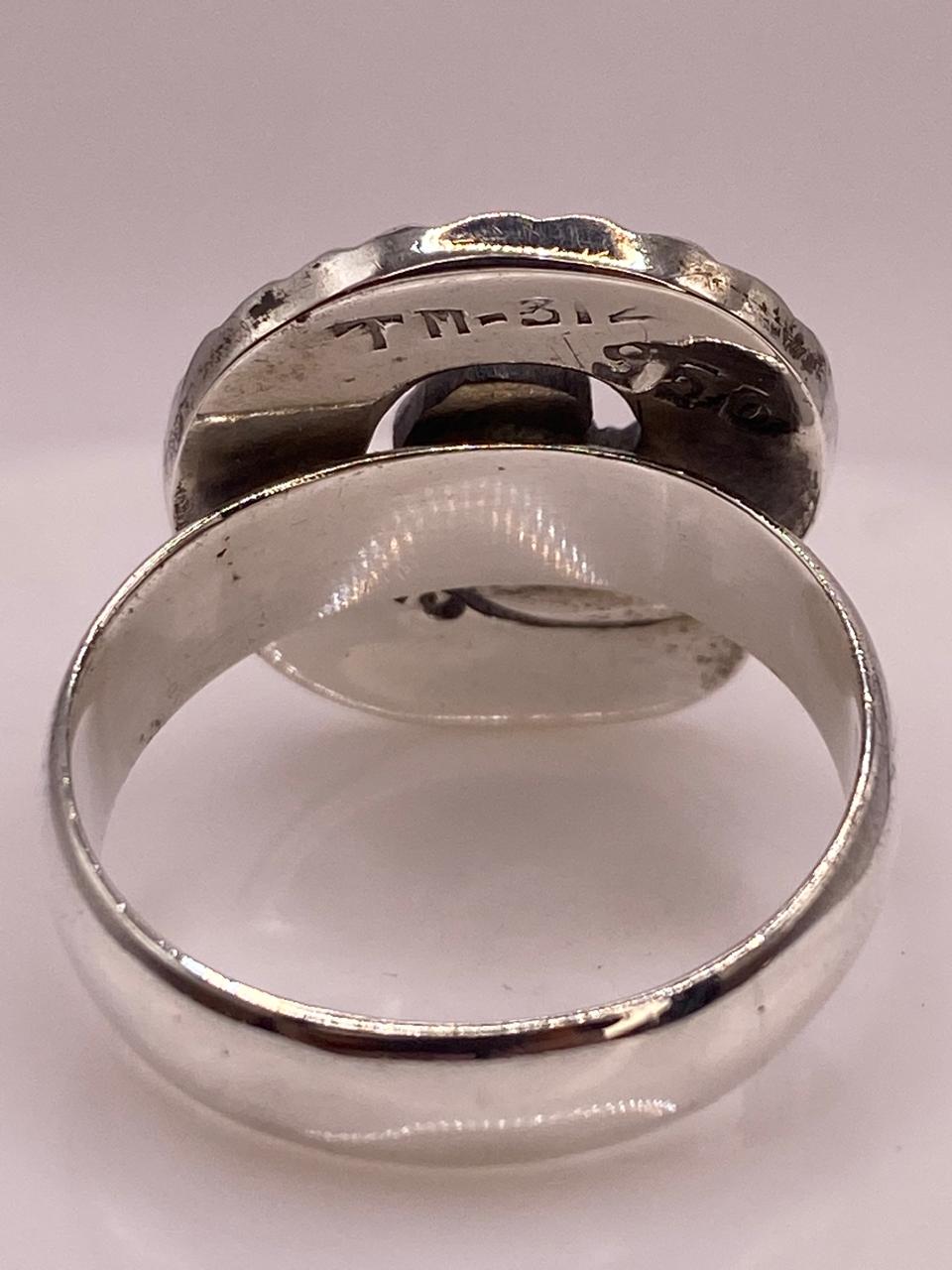 Anillo en Espiral con Ópalo de Fuego Tornasol en Plata .950, sello de autenticidad Plata Ley .925