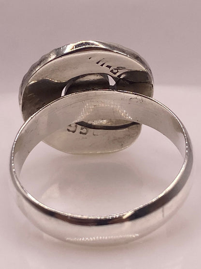 Anillo Espiral de Plata 950 con Ópalo de Fuego, sello de autenticidad Plata Ley .925