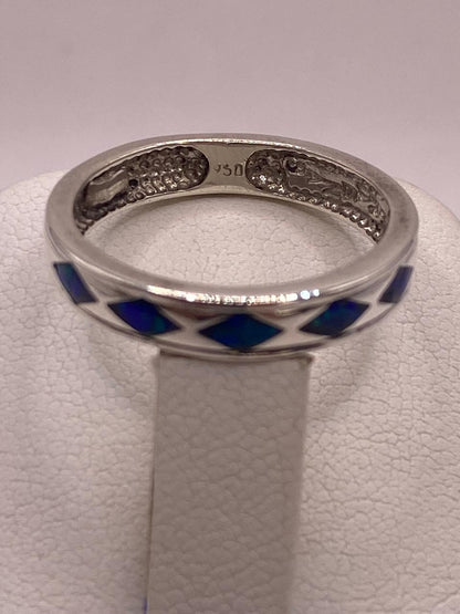Anillo con Figuras de Rombo Plata 950 con Ópalo de Fuego, sello de autenticidad Plata Ley .925