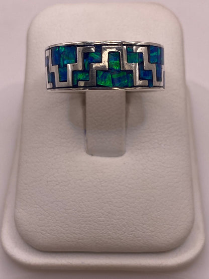 Anillo Greca Geometrica Continua con Ópalo de Fuego en Plata .950 en báscula mostrando peso