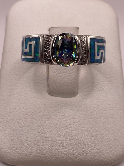 Anillo Greca Geométrica con Ópalo de Fuego y Zirconia en Plata .950 en báscula mostrando peso