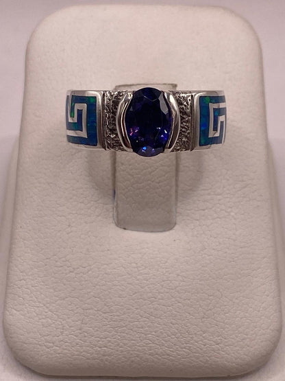 Anillo de Greca con Ópalo de Fuego y Zirconia en Plata .950 en báscula mostrando peso
