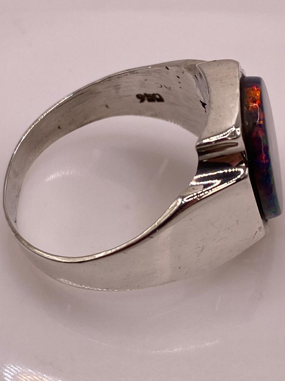 Anillo Montura Ovalada Contemporánea Plata Ley 950 con Ópalo de Fuego, sello de autenticidad Plata Ley .925