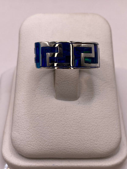Anillo con Ópalo de Fuego Azul‑Verde Diseño Greca en Plata Ley 950