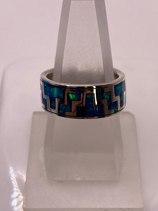 Anillo de Ópalo de Fuego Azul‑verde con Diseño Geométrico en Plata Ley 950 — vista lateral
