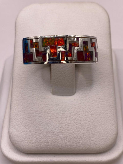 Anillo de Ópalo de Fuego con Diseño Geométrico en Plata Ley 950, vista lateral