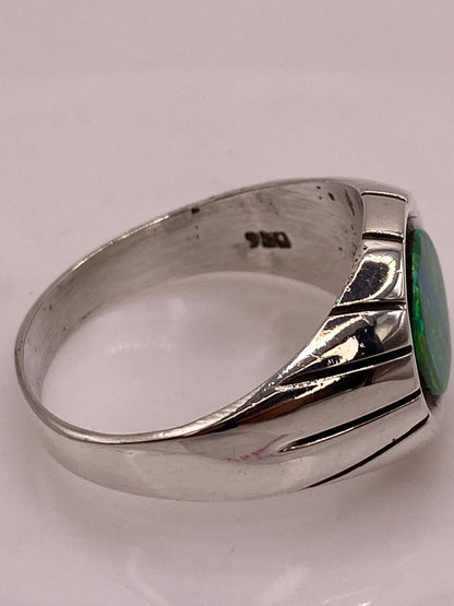 Anillo con Ópalo de Fuego Verde en Plata .950, sello de autenticidad Plata Ley .925