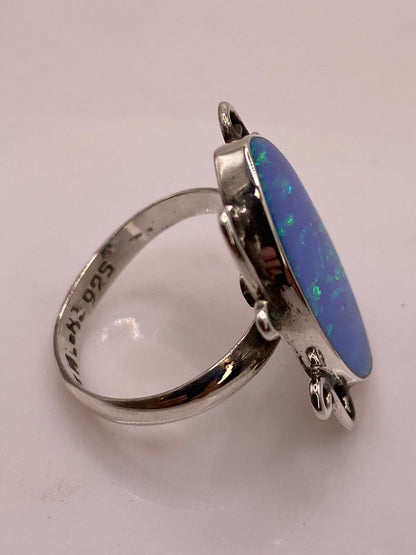 Anillo Ovalado Ajustable con Ópalo de Fuego en Plata .925, sello de autenticidad Plata Ley .925