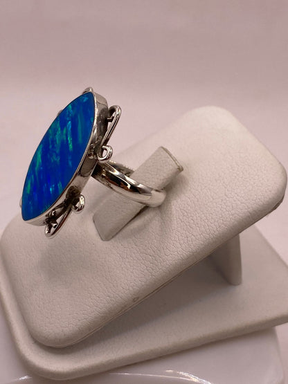 Anillo Ovalado Ajustable con Ópalo de Fuego en Plata .925, vista lateral