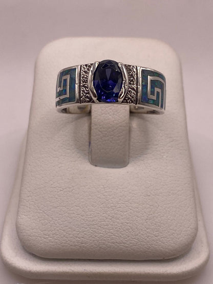 Anillo de Plata 950 con Ópalo de Fuego y Zirconia Azul, vista lateral