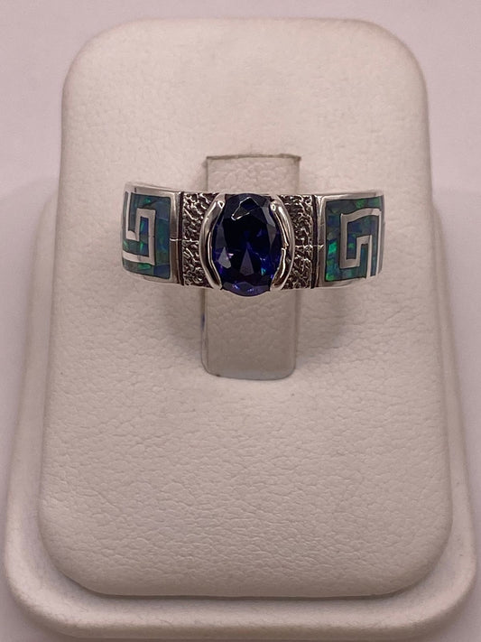 Anillo de Plata 950 con Ópalo de Fuego y Zirconia Azul — ángulo diagonal