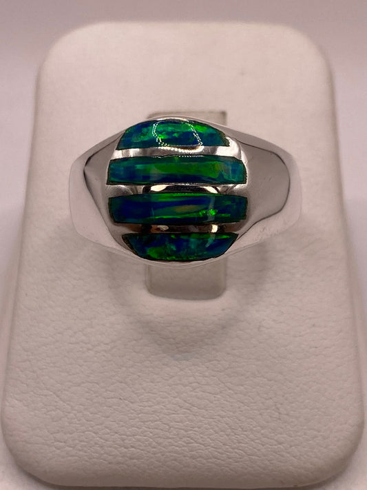 Anillo en Plata Ley 950 con Ópalo de Fuego Diseño Ovalado Segmentado en báscula mostrando peso
