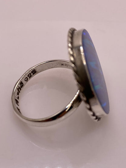 Anillo Redondo Ajustable con Ópalo de Fuego Azul y Verde en Plata .925, sello de autenticidad Plata Ley .925