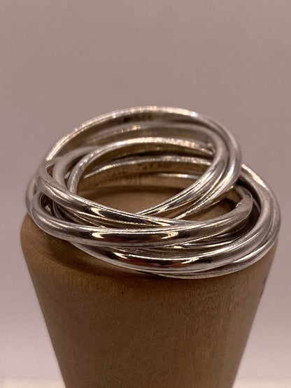 Anillo Semanario de 7 Aros Entrelazados en Plata .925, vista lateral