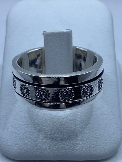Anillo Spinner de Plata .925 con Diseño de Soles, vista lateral