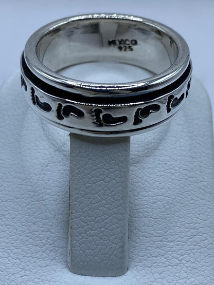 Anillo Spinner de Plata .925 con Diseño de Huellas, sello de autenticidad Plata Ley .925