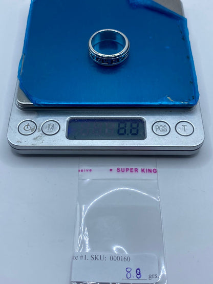 Anillo giratorio plata 925 diseño simbólico prehispánico talla 9 junto a referencia de escala Arte Taxco
