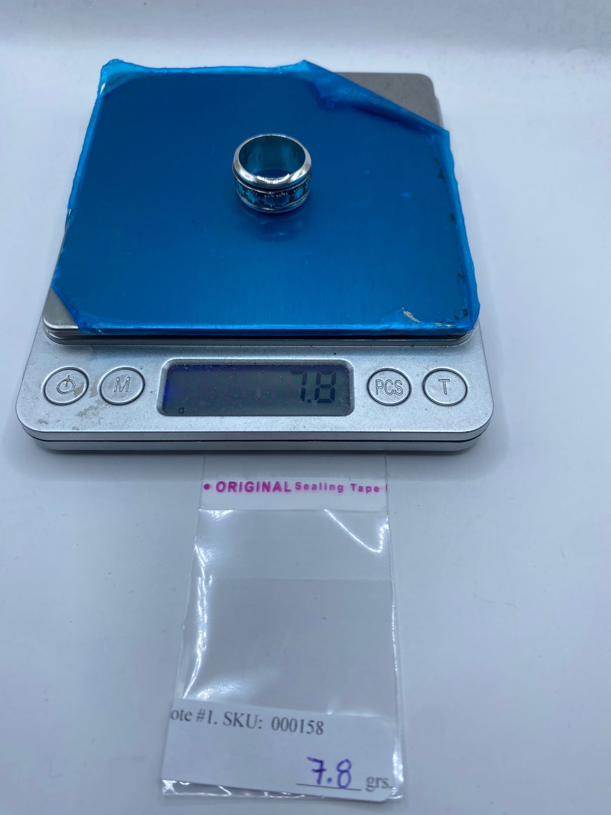 nillo giratorio plata 925 soles prehispánicos mujer talla 5 junto a referencia de escala, Arte Taxco